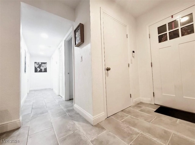 entrance foyer with light tile patterned floors