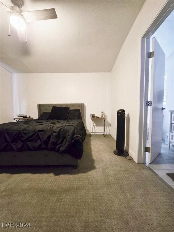 carpeted bedroom featuring ceiling fan and lofted ceiling