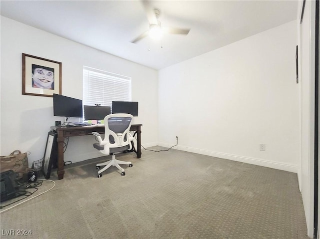 carpeted home office with ceiling fan