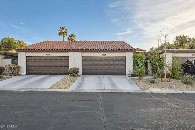 mediterranean / spanish-style house featuring a garage