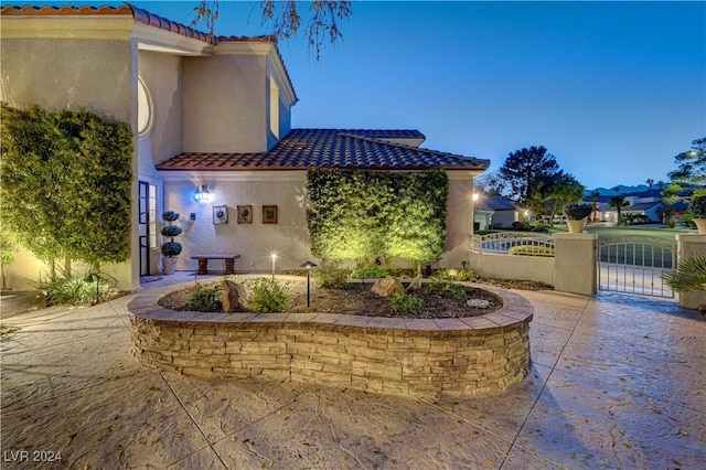 view of patio terrace at dusk