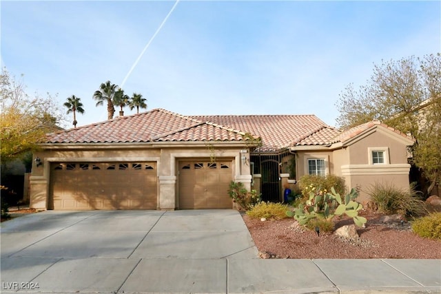 mediterranean / spanish-style house featuring a garage