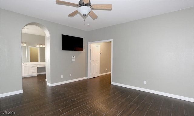 spare room featuring dark hardwood / wood-style floors and ceiling fan