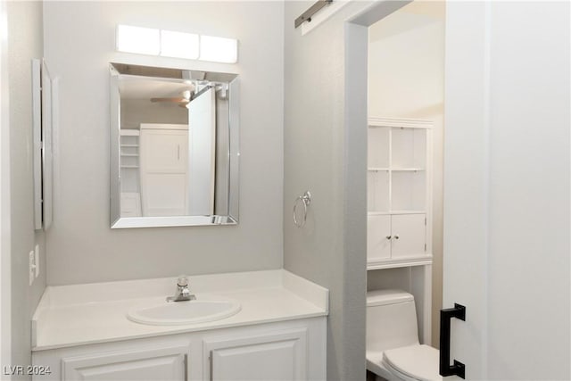 bathroom featuring vanity and toilet