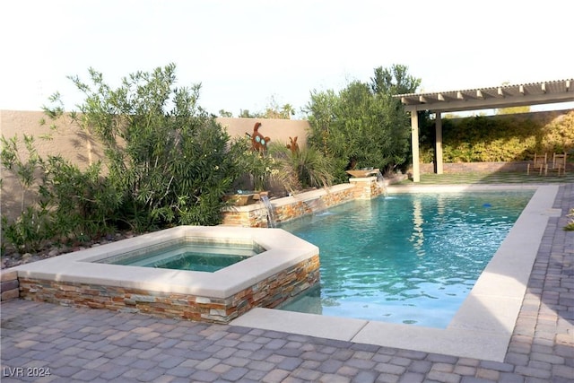 view of swimming pool featuring pool water feature, a pergola, and an in ground hot tub