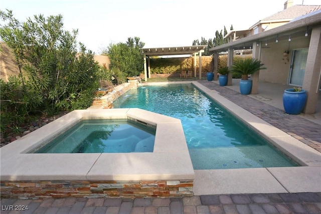 view of swimming pool featuring a pergola and an in ground hot tub