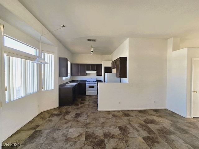 kitchen featuring sink and white appliances