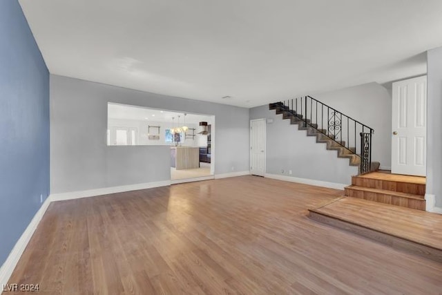 unfurnished living room with hardwood / wood-style flooring