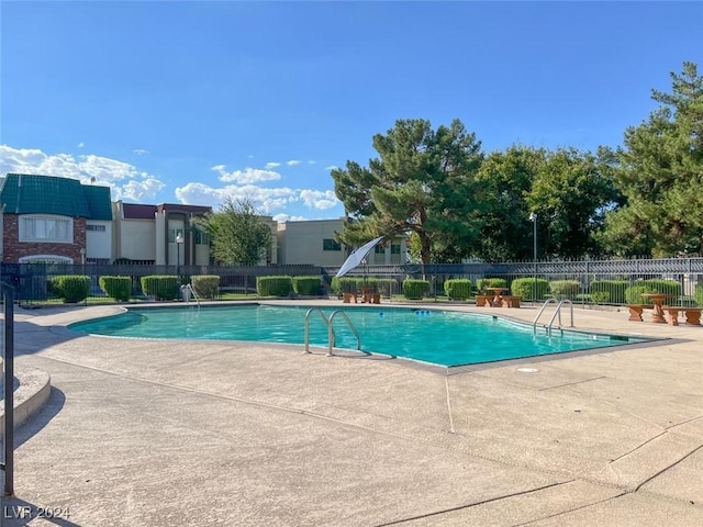 view of pool featuring a patio