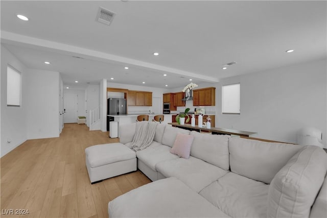 living room with light hardwood / wood-style flooring