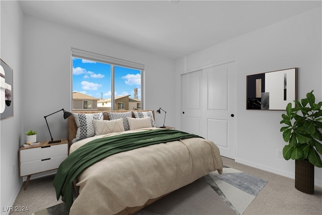 bedroom with carpet and a closet