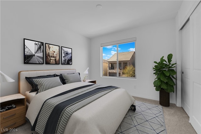 carpeted bedroom with a closet