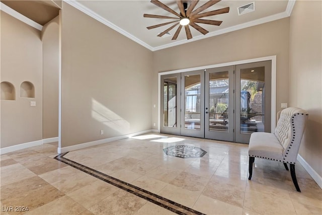 entryway featuring ceiling fan, french doors, and ornamental molding