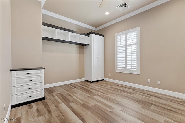 unfurnished bedroom featuring light hardwood / wood-style flooring and ornamental molding