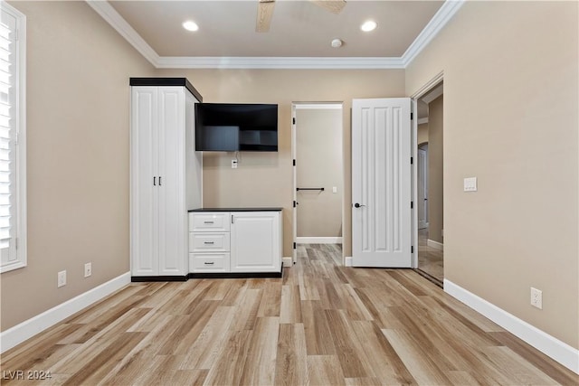 unfurnished bedroom with light wood-type flooring and ornamental molding