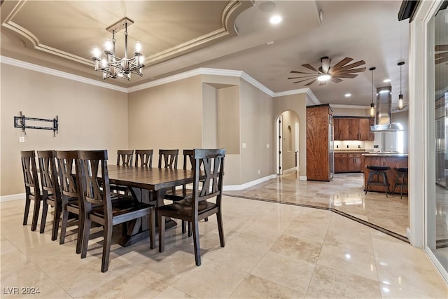 dining space with crown molding and ceiling fan with notable chandelier