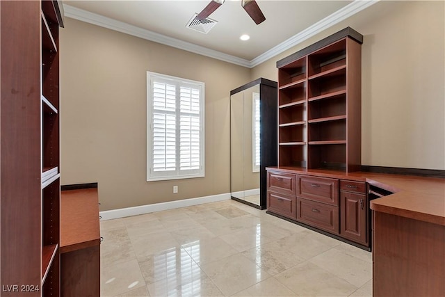 unfurnished office featuring ceiling fan and ornamental molding