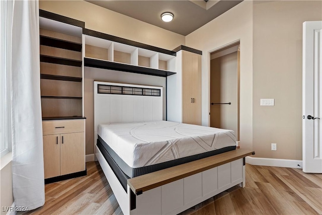 bedroom with light wood-type flooring