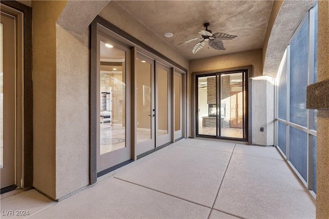 view of patio featuring ceiling fan