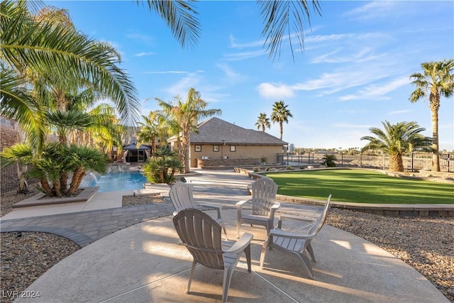 view of patio / terrace with pool water feature and a fenced in pool