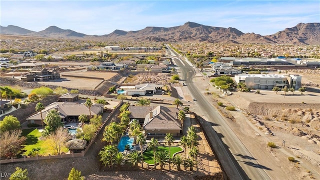 birds eye view of property featuring a mountain view