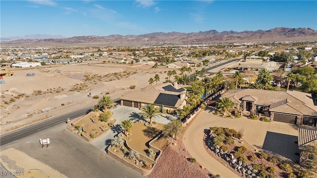 birds eye view of property with a mountain view