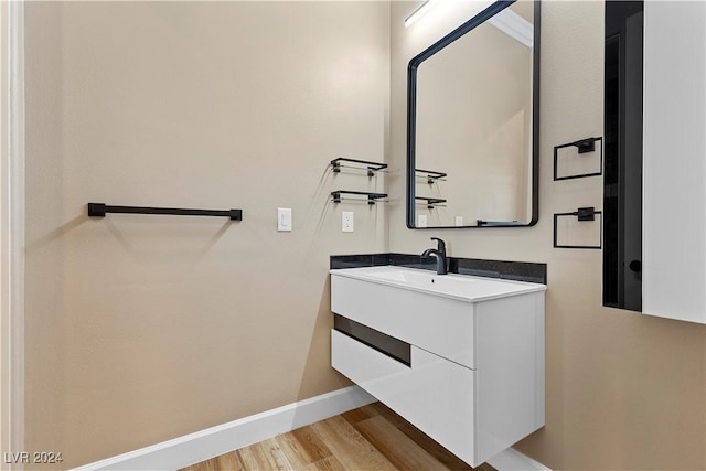 bathroom featuring hardwood / wood-style floors and vanity