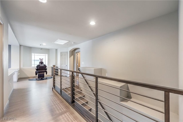 hall with wood-type flooring