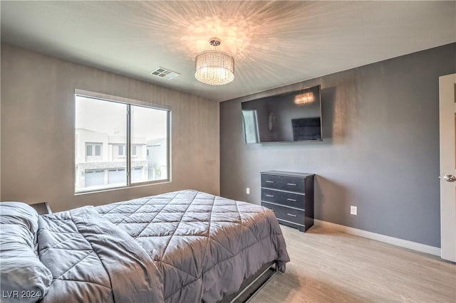 bedroom with light hardwood / wood-style flooring