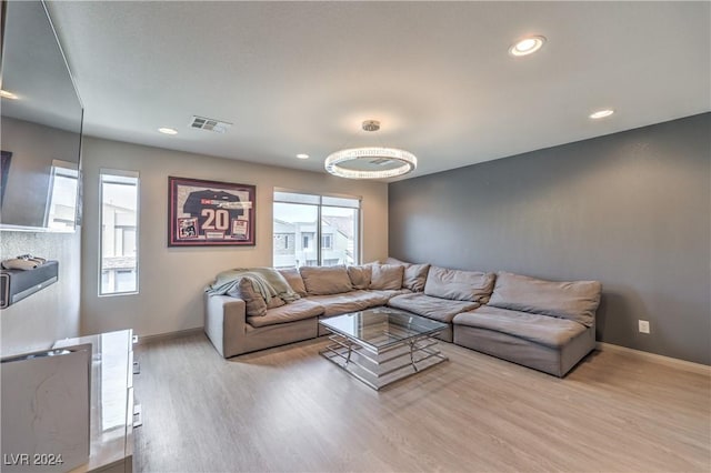 living room with plenty of natural light and light wood-type flooring