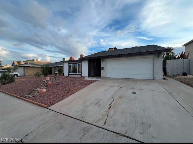 single story home featuring a garage