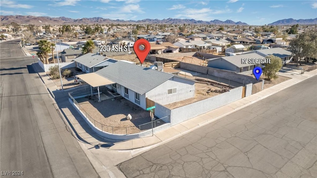 birds eye view of property with a mountain view