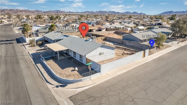 birds eye view of property with a mountain view