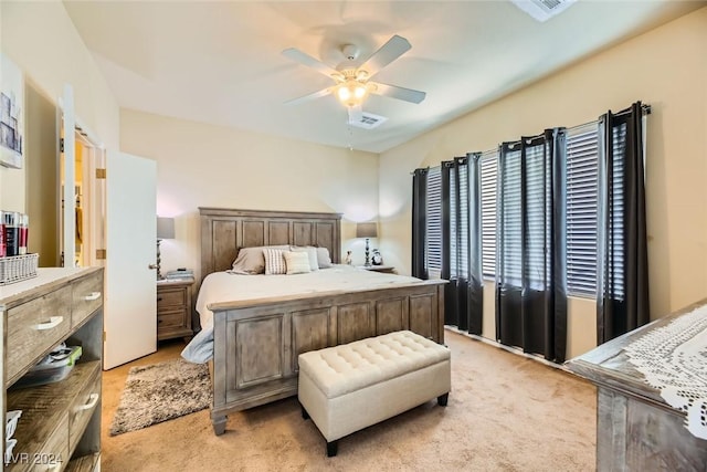 bedroom with ceiling fan and light colored carpet