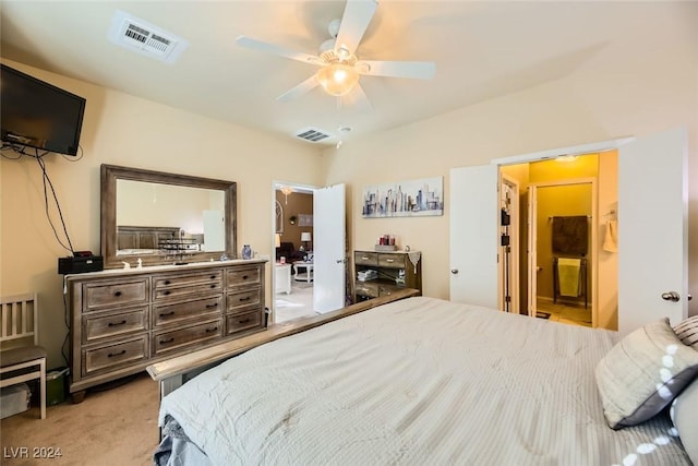 carpeted bedroom featuring connected bathroom and ceiling fan