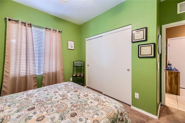 bedroom with carpet floors and a closet