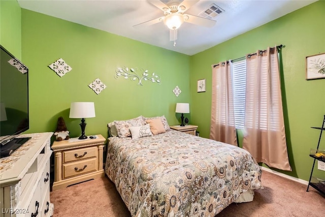 bedroom with ceiling fan and light carpet