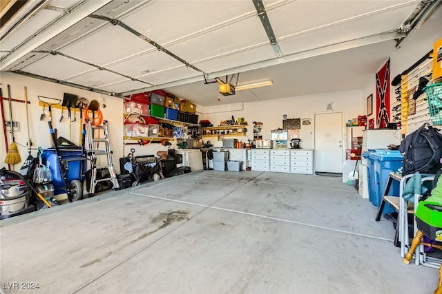 garage featuring a workshop area and a garage door opener