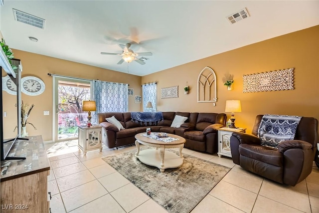 tiled living room featuring ceiling fan