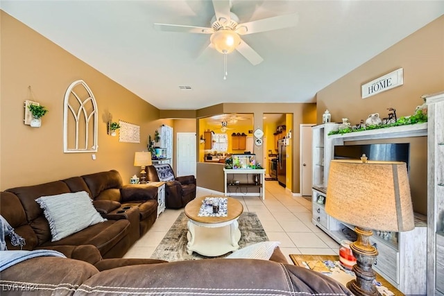 tiled living room with ceiling fan