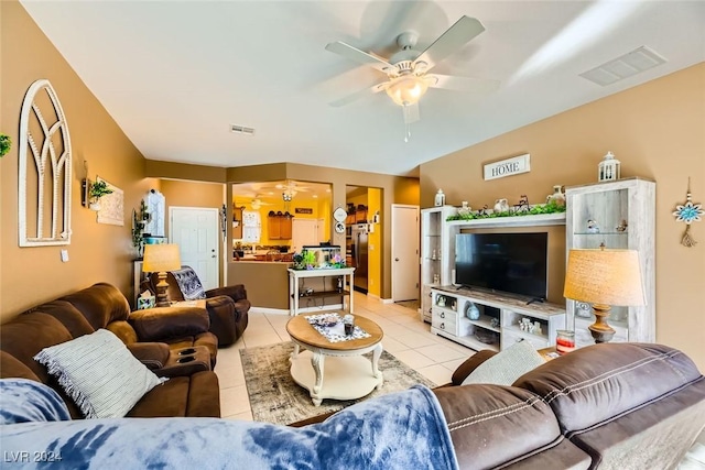 living room featuring ceiling fan and light tile patterned floors