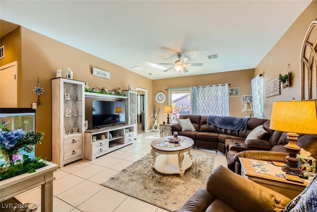 living room with light tile patterned floors and ceiling fan