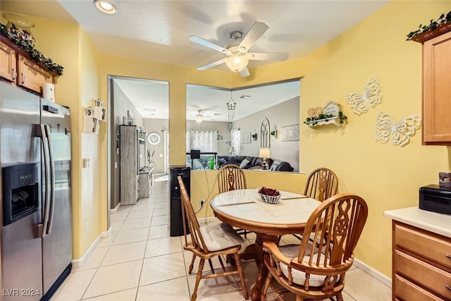 dining room featuring ceiling fan and light tile patterned flooring