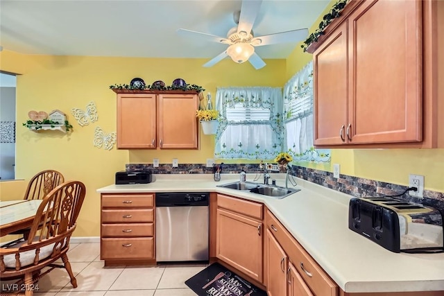 kitchen featuring light tile patterned floors, stainless steel dishwasher, ceiling fan, and sink