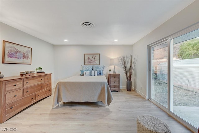 bedroom with access to outside and light hardwood / wood-style flooring