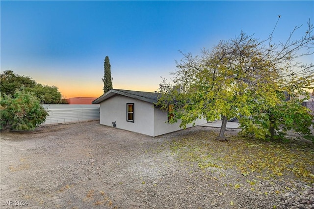 view of property exterior at dusk