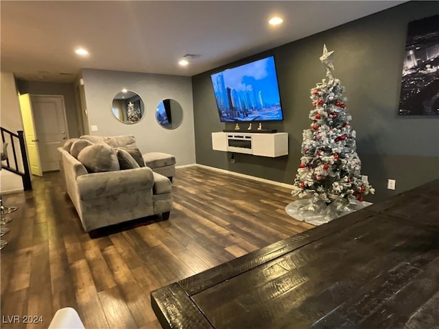 living room with dark hardwood / wood-style flooring