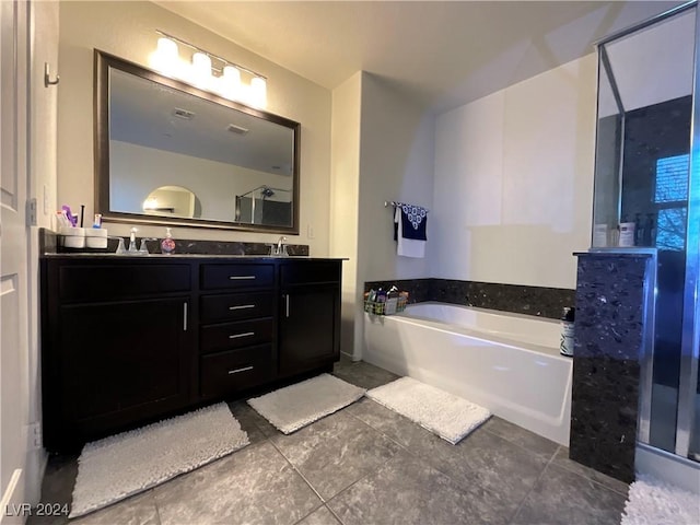 bathroom featuring vanity, shower with separate bathtub, and tile patterned floors