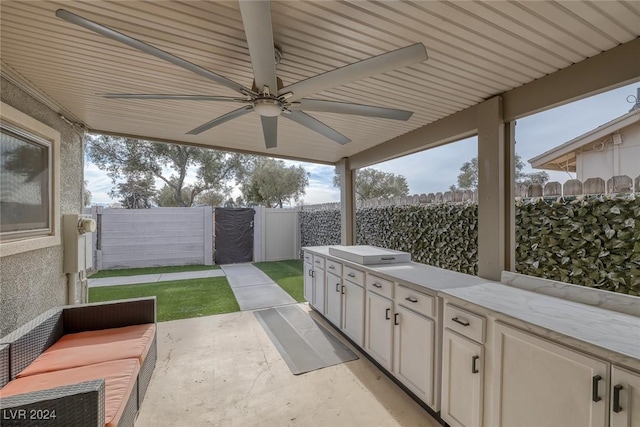 view of patio with ceiling fan