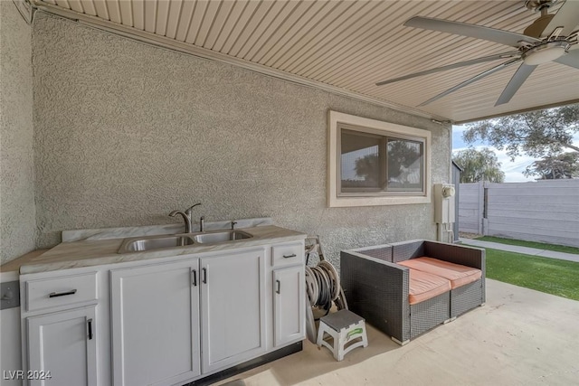 view of patio featuring area for grilling, ceiling fan, and sink